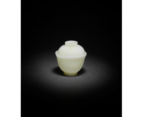 A VERY PALE GREEN JADE CUP AND COVER18th/19th centuryThe vessel finely carved with deep sides flaring to the rim from the nea
