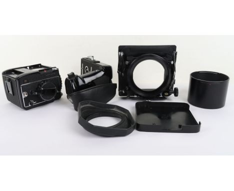 Mamiya 645 1000S Camera body, serial no. L182323. Mamiya bellows lens hood, Mamiya pistol grip, Mamiya lens hood, Mamiya rubb