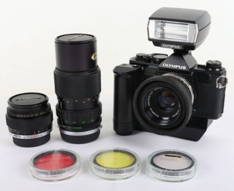 A Black Olympus OM-2 Spot/Program Camera and Lenses, serial no 1125817, untested, Olympus OM2 flash unit, a Zuiko auto S 50mm