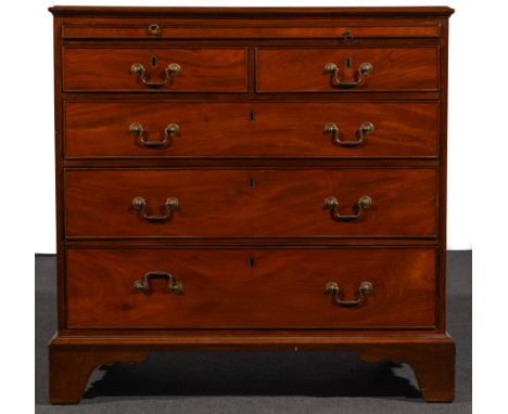 A George III mahogany small chest of drawers, rectangular top with moulded edge above a brushing slide, two short and three l