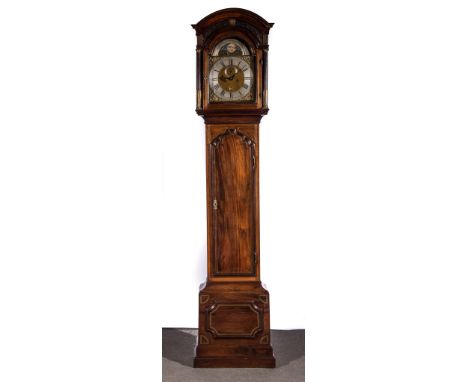 William Newman, LondonA mahogany longcase clock, arched top with a fretted frieze, turned and fluted columns, arched brass di