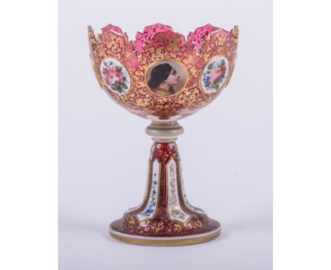 A Victorian ruby tinted and overlaid glass comport, rounded bowl with alternating panels depicting portrait heads and flower 