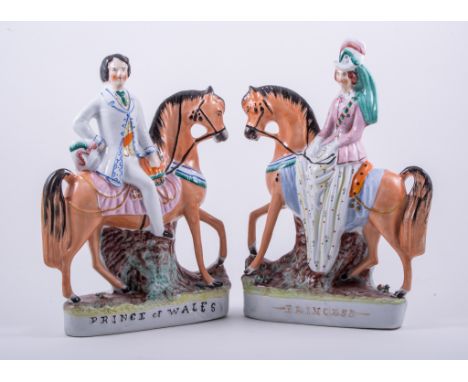 A pair of Staffordshire equestrian figures, Prince of Wales and Princess Alexandra of Denmark, painted in colours and titled 