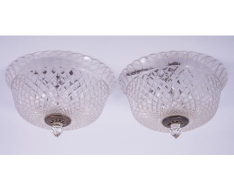 A pair of cut glass ceiling shades, circular domed form, hobnail cut, each with a plated boss and faceted finial, diameter 33