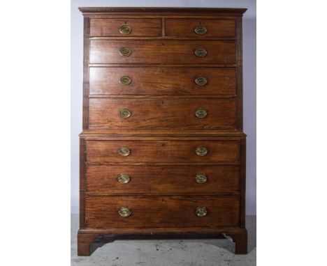 A George III mahogany chest on chest, dentil and cavetto moulded cornice, the upper section with two short and three long gra
