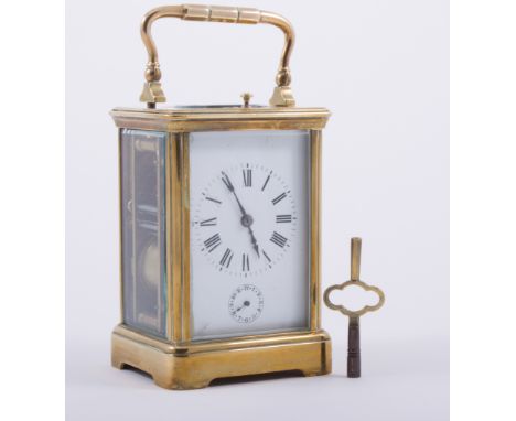 A French brass case repeating carriage clock, white enamelled dial with Roman numerals, subsidiary alarm dial, platform escap