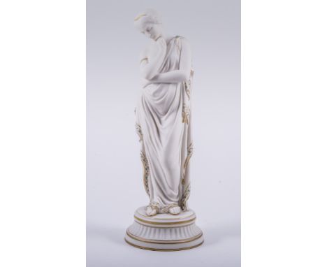 A Parian figure of a classical maiden, in the style of Copeland, gilt and turquoise enamel decoration, circular socle, 39cm.