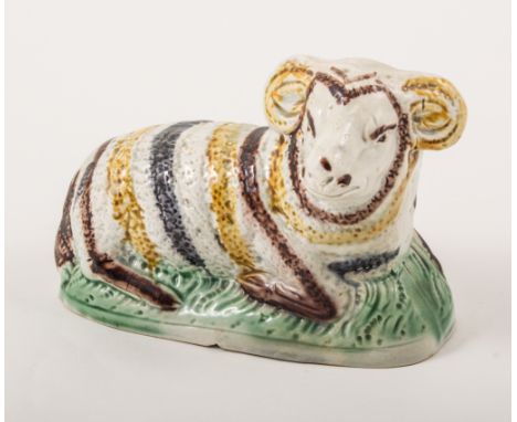 A Pearlware hollow-base model of ram, Staffordshire or Yorkshire, circa 1800, chipped, 11.5cm.