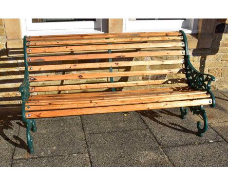 A Victorian Painted Cast Iron Scroll End Bench, with later slats, 150cm long