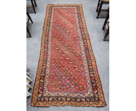 ~ Northwest Persian Runner, the soft brick field with one way design of stylised plants enclosed by triple borders, 280cm by 