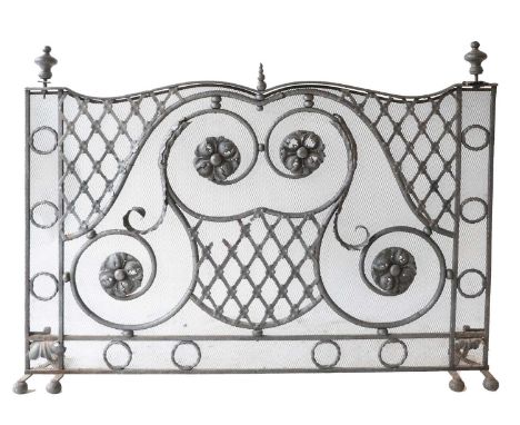 A Medieval Design Steel and Mesh Firescreen, the frame as C scrolls and flowerheads surmounted by turned finials, the base wi
