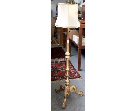 ~ A Giltwood Standard Lamp, the knopped pedestal raised over an acanthus tripod base, 123cm to fitting