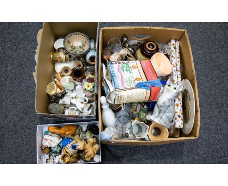 A Large Collection Of Mixed Ceramics And Collectibles Three boxes containing a variety of ornaments, earthenware items, cat f