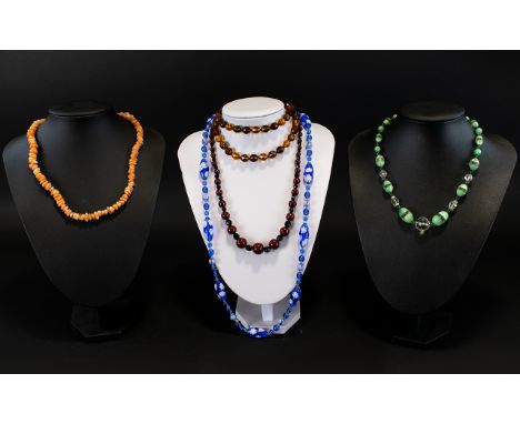 A Small Collection Of Vintage Beaded Glass Necklaces Five in total to include graduated claret and black bicone bead necklace