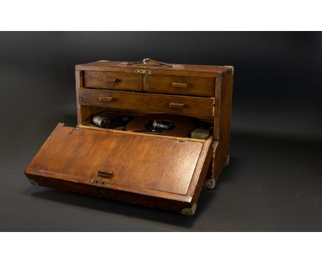 An Engineers Desktop Chest Of Tools Comprising fall front, two short, over one long drawer above a lift out tray. Contains a 