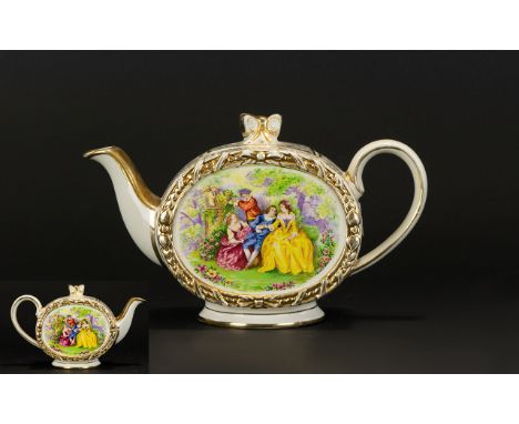 A Musical Teapot By Sadler Ceramic teapot with gilt trim throughout and figurative panel bordered by gilt ribbon trim to side