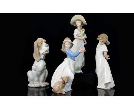 Four Nao Figures assorted poses and sizes, includes figure of young girl with basket, young girl with dog and a cake, young s