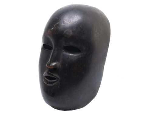 Guatemala, a hard wood mask, with dark patina.  L. 20 cm. Provenance: bought in Guatemala during carnival period, 1990's.  [1