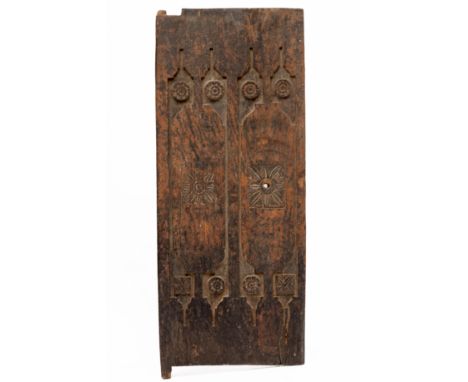 Bali, a carved wooden door, ca. 1900, decorated with carved flower heads. With encrusted patina.  113 x 45 cm.  [1]