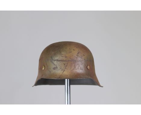 German WWII helmetSizes: L. totale= 290mm H = 140mmWeight (K): 1,2kgCondition: At first glance: patina, normal wear