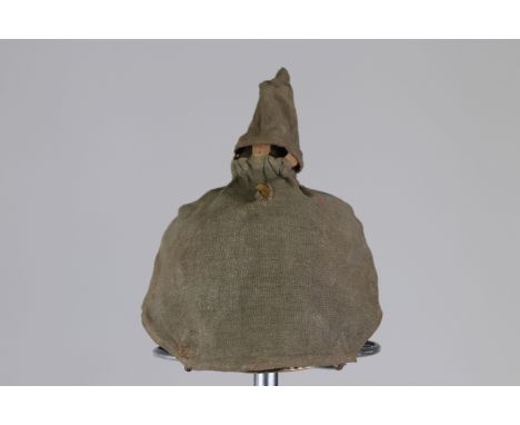 German 14-18 infantry helmet with protective coverSizes: L. totale= 230 mm H = 260mmWeight (K): 0,39kgCondition: At first gla