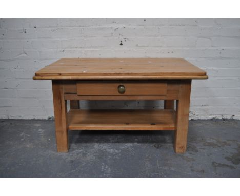 Modern pine coffee table, rectangular boarded top with rounded corners, frieze drawer, legs joined by a shelf, top 94cm x 64c