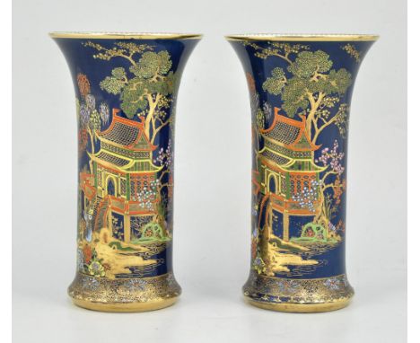 Pair of Carltonware vases, powder blue ground, enamelled with chinoiserie scenes, height 20.5cm, one cracked, (2).