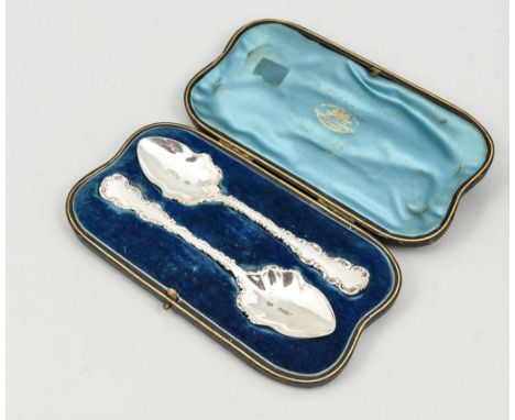 A pair of silver serving spoons, scrolled outlines, Goldsmiths & Silversmiths Company, London 1901, cased, and six similar st