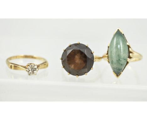 Yellow metal dress ring, stamped 14k, set with a jade coloured stone, size N/O, large gold dress ring, size M/N and a 9ct gol