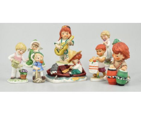 Nine Goebel figures, including 'Swinger' and 'Lazy Day' Redhead figures by Charlot Byj, (9).