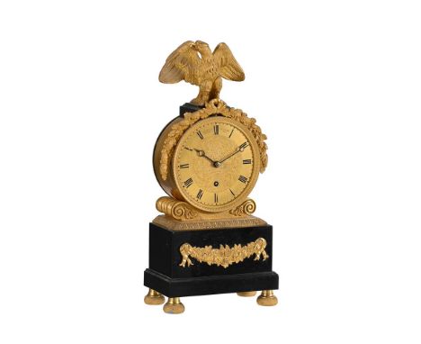 A REGENCY ORMOLU AND BLACK MARBLE SMALL 'DRUM-HEAD' MANTEL TIMEPIECEBROCKBANK AND ATKINS, LONDON, CIRCA 1825The circular four