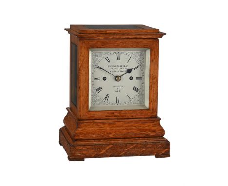 A VICTORIAN OAK FOUR GLASS MANTEL CLOCKLUND AND BLOCKLEY, LONDON, CIRCA 1875The five columnar pillar twin chain fusee gong st