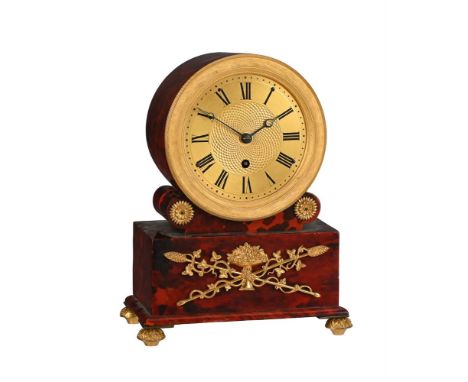 Y&nbspAN UNUSUAL REGENCY GILT BRASS MOUNTED TORTOISESHELL SMALL DRUM-HEAD MANTEL TIMEPIECEUNSIGNED, CIRCA 1825The circular fo