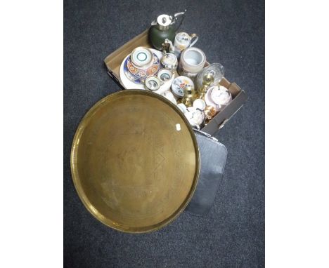 A brass Eastern plaque, cased vintage typewriter machine and a box of assorted china, plated lidded hand painted jug, candles
