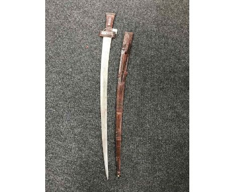 An Eastern leather handled sword in scabbard