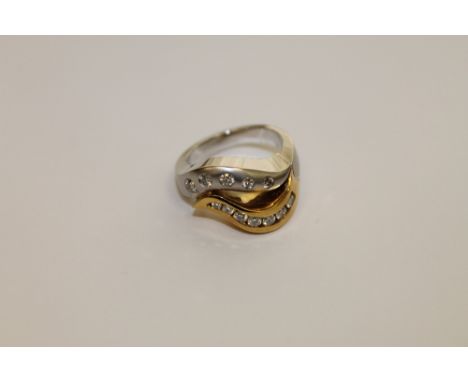 An 18ct gold yellow and white gold ring set with 12 diamonds, 14.0g