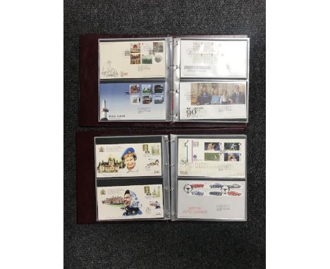 Two albums of Royal Mail first day covers - Classic Toys, Hampton Court Palace, etc, etc.  (2) 