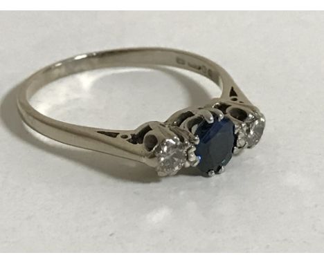 An 18ct gold sapphire and diamond ring