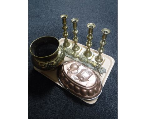 A tray of two pairs of brass candlestick, brass embossed planter, brass door handle, vintage copper jelly mould 
