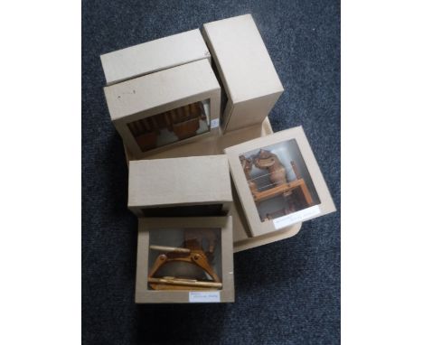 A tray of six boxed hand built wooden toys including baby rocking horse, crocodile drummer etc 