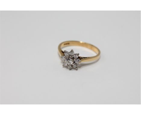 An 18ct gold diamond cluster ring, size N