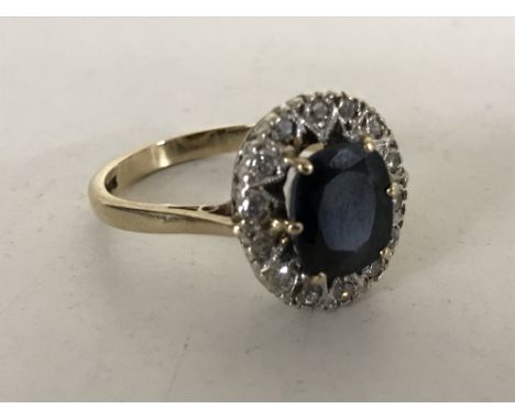 A 9ct gold sapphire diamond cluster ring, size O.