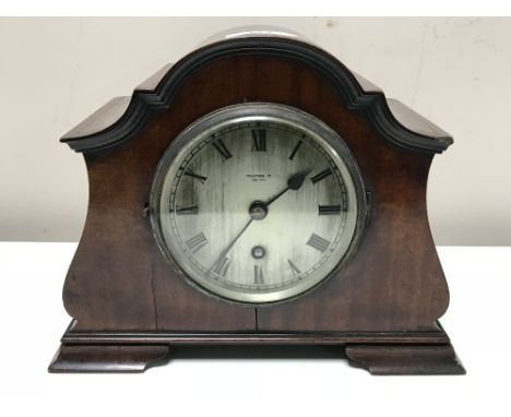 A mahogany cased mantel clock with silvered dial signed Prestons, Bolton 