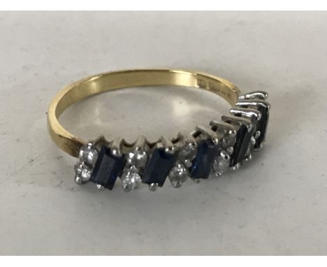 An 18ct gold sapphire and diamond half eternity ring, size N.