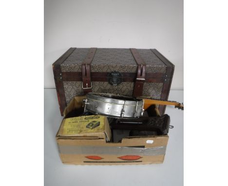 A vintage style trunk together with a box of banjo frame, carved oak barometer, Hornby power control unit etc 