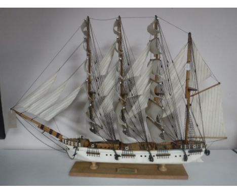 A wooden model of a four masted baroque sailing ship on stand 