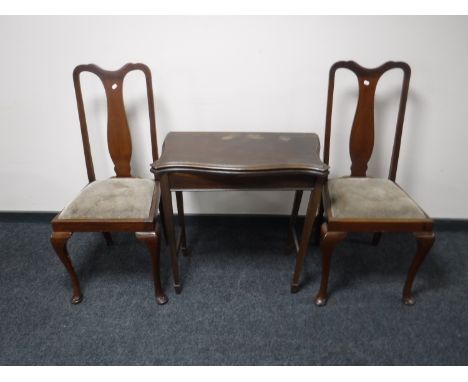 A pair of Queen Anne style dining chairs and a mahogany foldover card table 