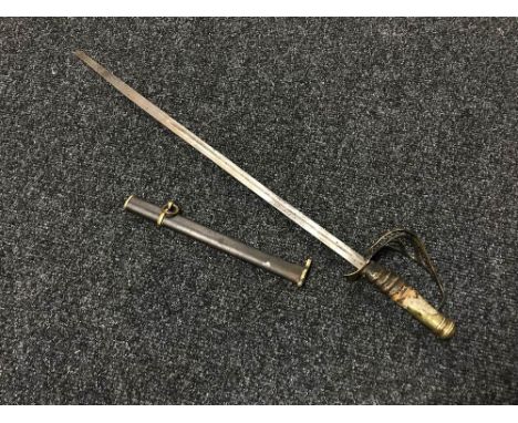 An early 20th century miniature sword with part scabbard CONDITION REPORT: 60cm overall. 