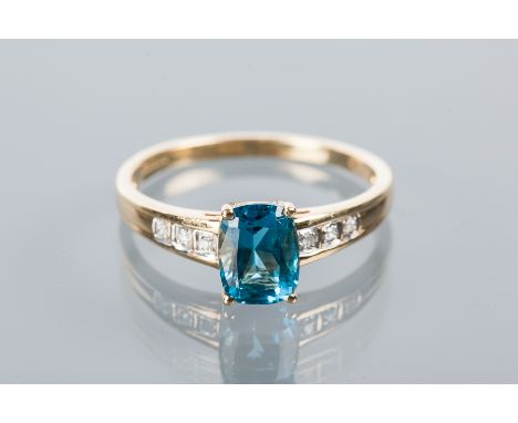 BLUE ZIRCON AND DIAMOND RING
set with an emerald cut blue zircon measuring 8.09mm flanked by brilliant cut diamond shoulders,