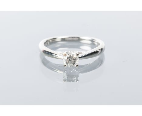 DIAMOND SOLITAIRE RING 
the brilliant cut diamond approximately 0.33 carats, in nine carat white gold, size J